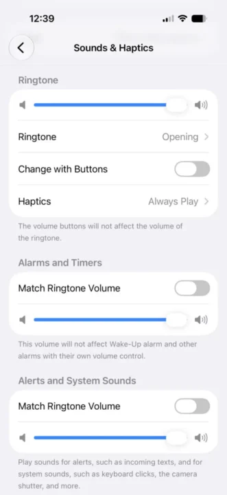 iPhone Sounds & Haptics settings screen showing Ringtone options, a volume slider, and toggle switches for Change with Buttons and Haptics.