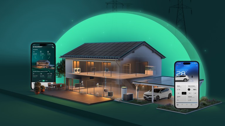 Smart home with solar panels and connected devices shown alongside two smartphones displaying energy management apps.