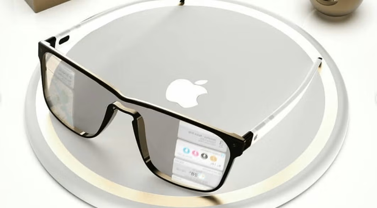 Pair of black-rimmed glasses resting on a circular device with an Apple logo, on a white surface.