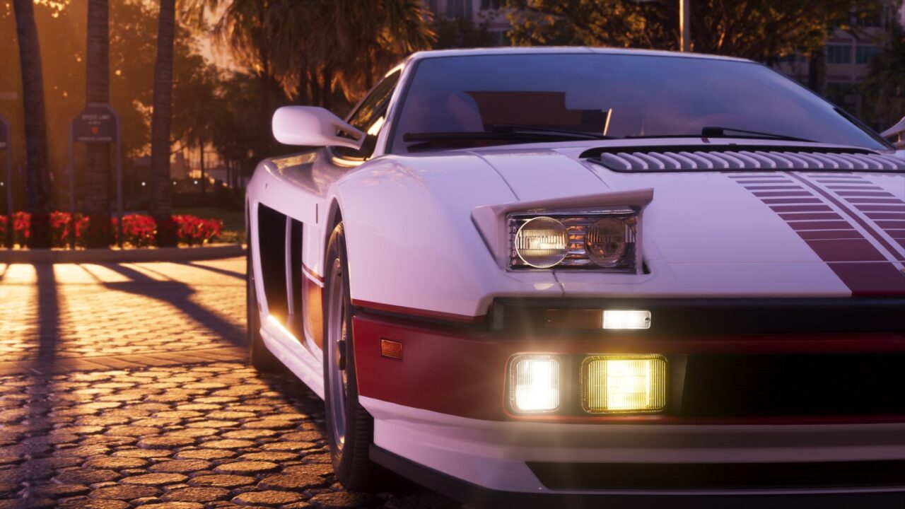 White Vintage Sports Car with a Red Stripe Front View on a Cobblestone Street at Sunset