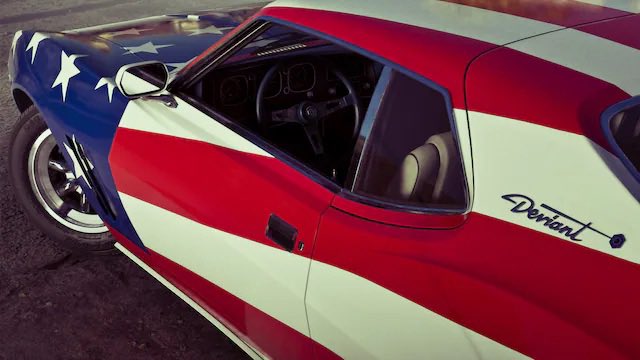 Classic Sports Car with a Bold Red White and Blue Star spangled Paint Job and an Open Driver side Window