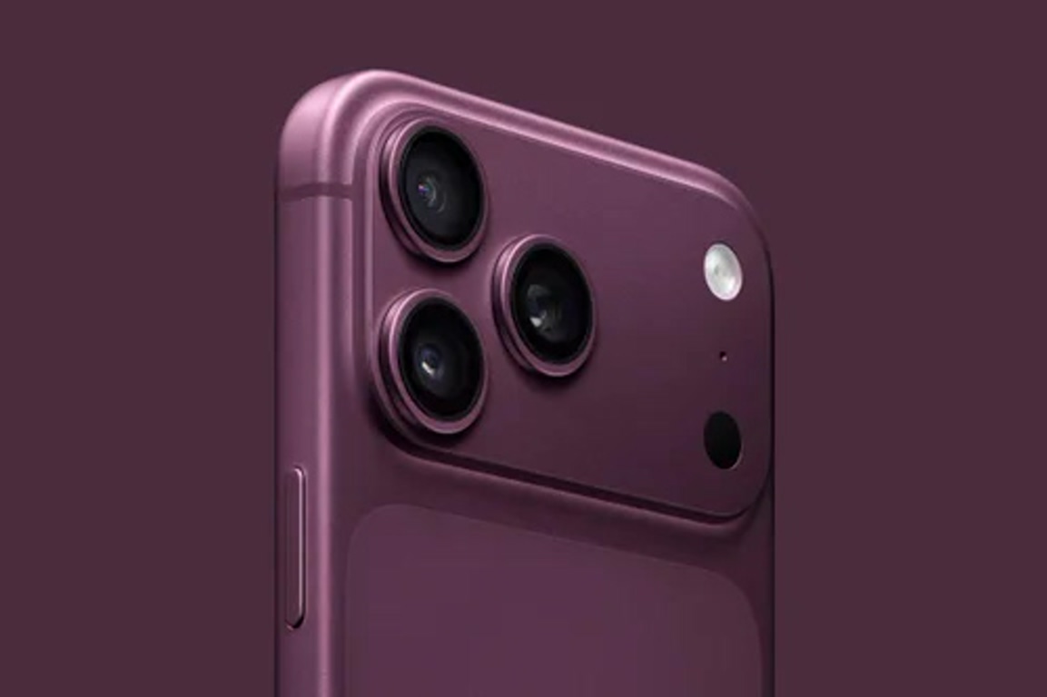 Purple iPhone back showing the triple-camera system and flash near the top-left corner.