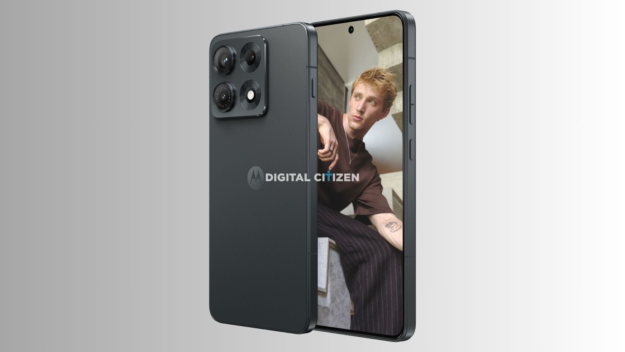 Close-up of a dark smartphone with a quad-camera module on the back; screen shows a man leaning on stairs with a Digital Citizen watermark.