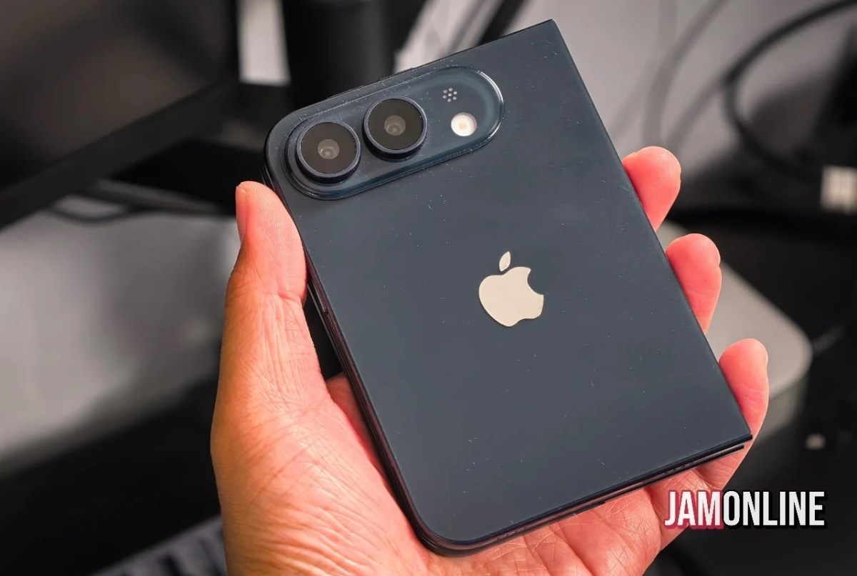 Back view of a dark blue iPhone with a prominent triple-camera module in the top-left corner and the Apple logo centered on the back.