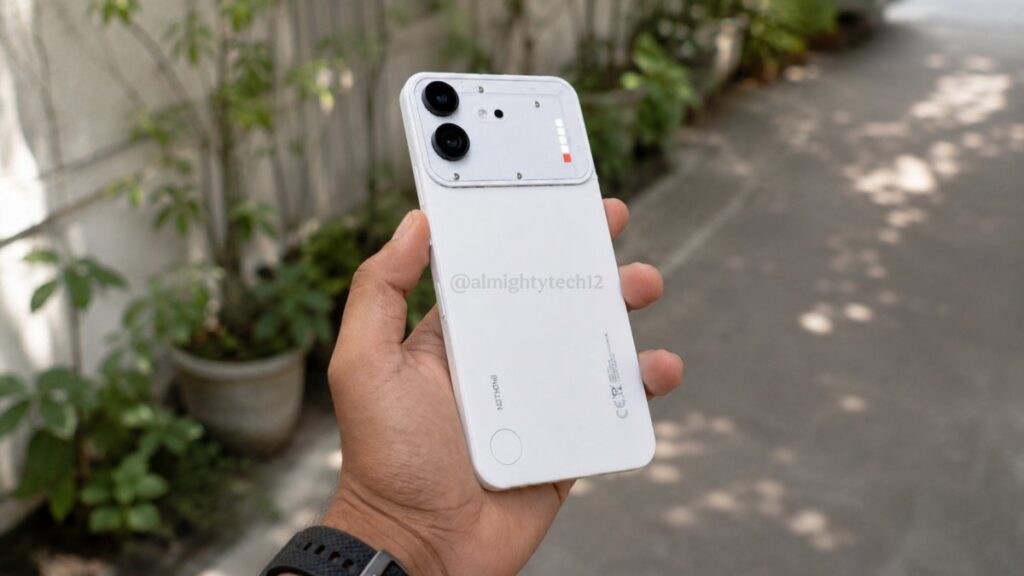 Person holding a white smartphone with a dual-camera rear setup outdoors along a sidewalk.