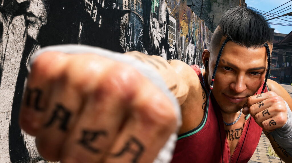 Man with Braided Hair and Tattoos Throws a Punch Toward the Camera in an Urban Alley with a Graffiti covered Wall Behind Him