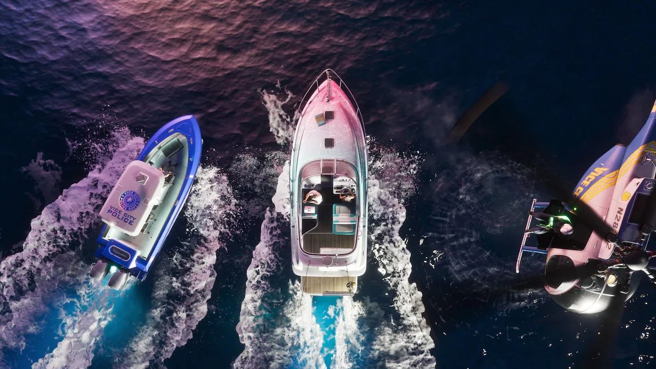 Aerial View of Three Speedboats at Sea Blue Police Boat on the Left Pink white Center Boat and a Helicopter Hovering Above the Right