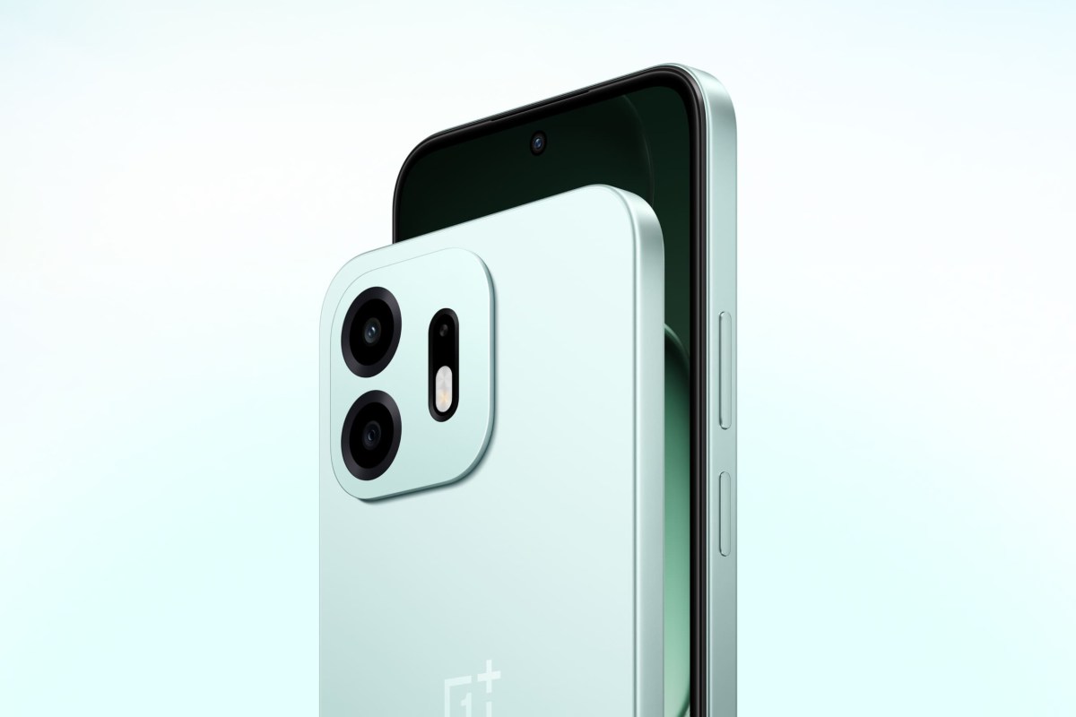 Close-up of a mint-green smartphone back with a square triple-camera module and flash on the left edge edge of the module.