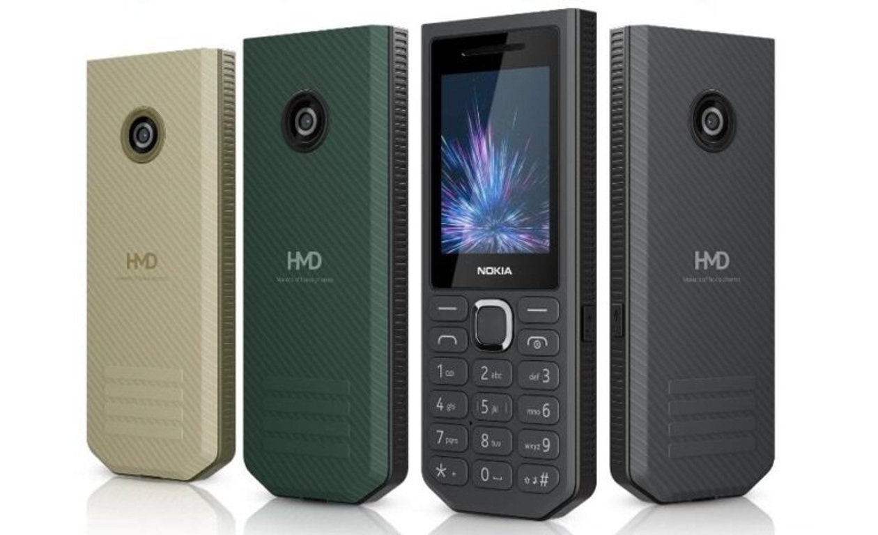 Four Nokia feature phones in beige, green, black, and gray, shown from the back and center phone displaying keypad.