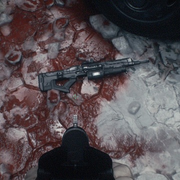 Hm kdkkwsae8 vi Overhead View of a Black Rifle Lying on Blood streaked Ice or Snow with a Dark Object in the Foreground Nearby