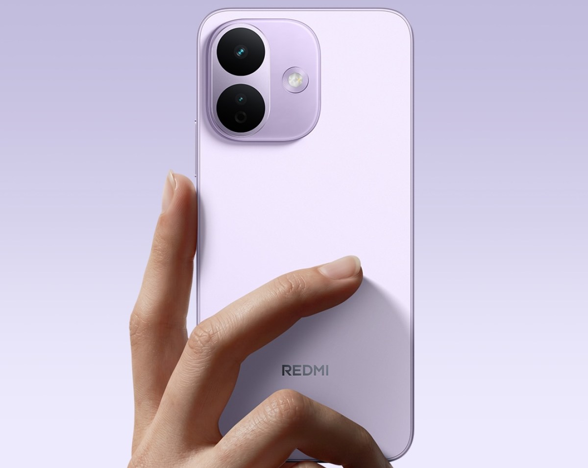 Purple Redmi smartphone held in a hand, showing a square camera module with two lenses and flash on the back.