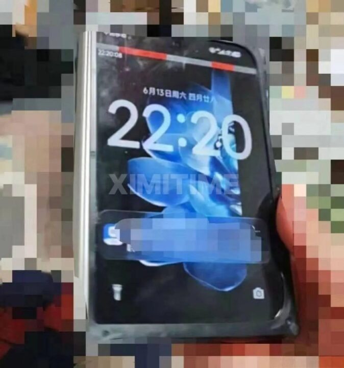 Close-up of a smartphone in a protective case showing 22:20 on the lock screen, with a watermark across the display and a pixelated background.