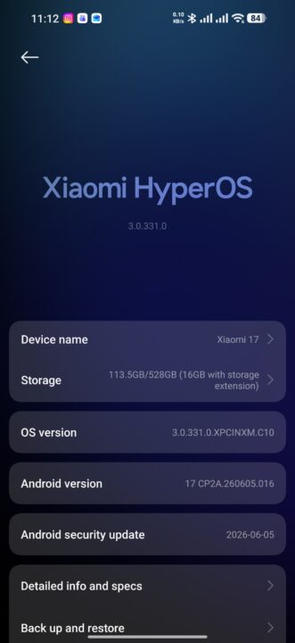 Xiaomi HyperOS setup screen showing device info: device name, storage, OS version, Android version, security update date, and backup options in rounded panels on a dark blue gradient background