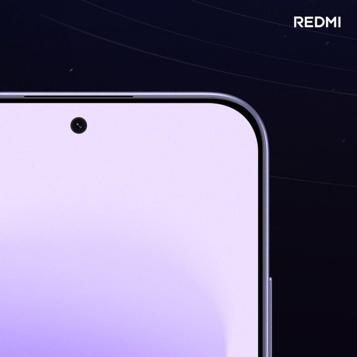 Close-up of a pink smartphone screen with a small top-left camera hole and rounded edges; Redmi logo appears in the top-right corner.