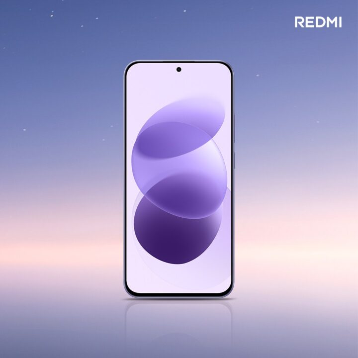 Front view of a Redmi smartphone standing upright, displaying purple abstract wallpaper against a soft gradient sky background, Redmi logo top-right (marketing image).