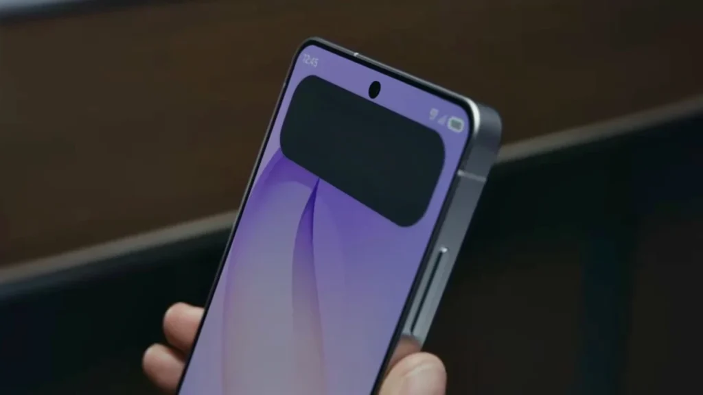 Close-up of a smartphone held in a hand, showing a purple wallpaper and a prominent black camera module at the top edge of the device.