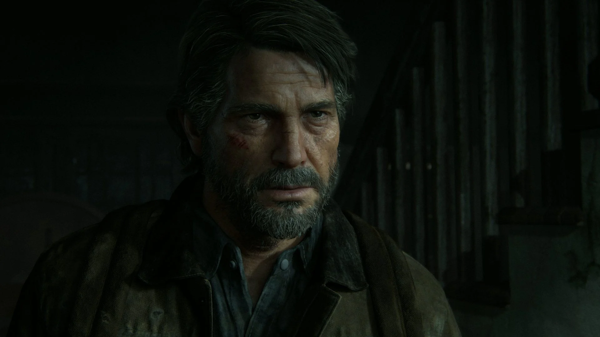 Man with a Gray Beard in a Dark Dusty Room Looking Somber