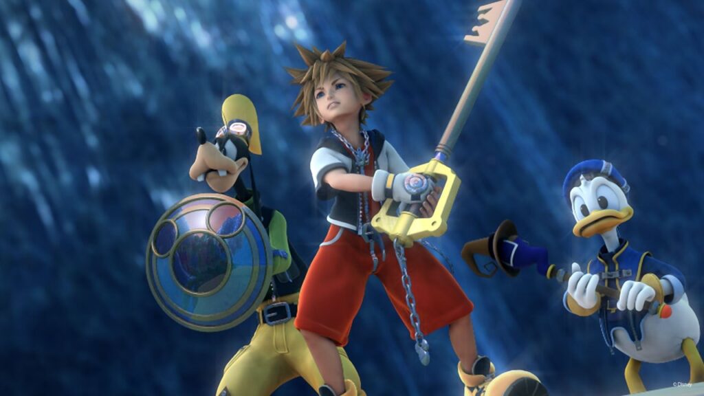 Sora Holds a Large Keyblade Flanked by Goofy with a Circular Shield and Donald Duck in Armor Set Against an Icy Blue Backdrop