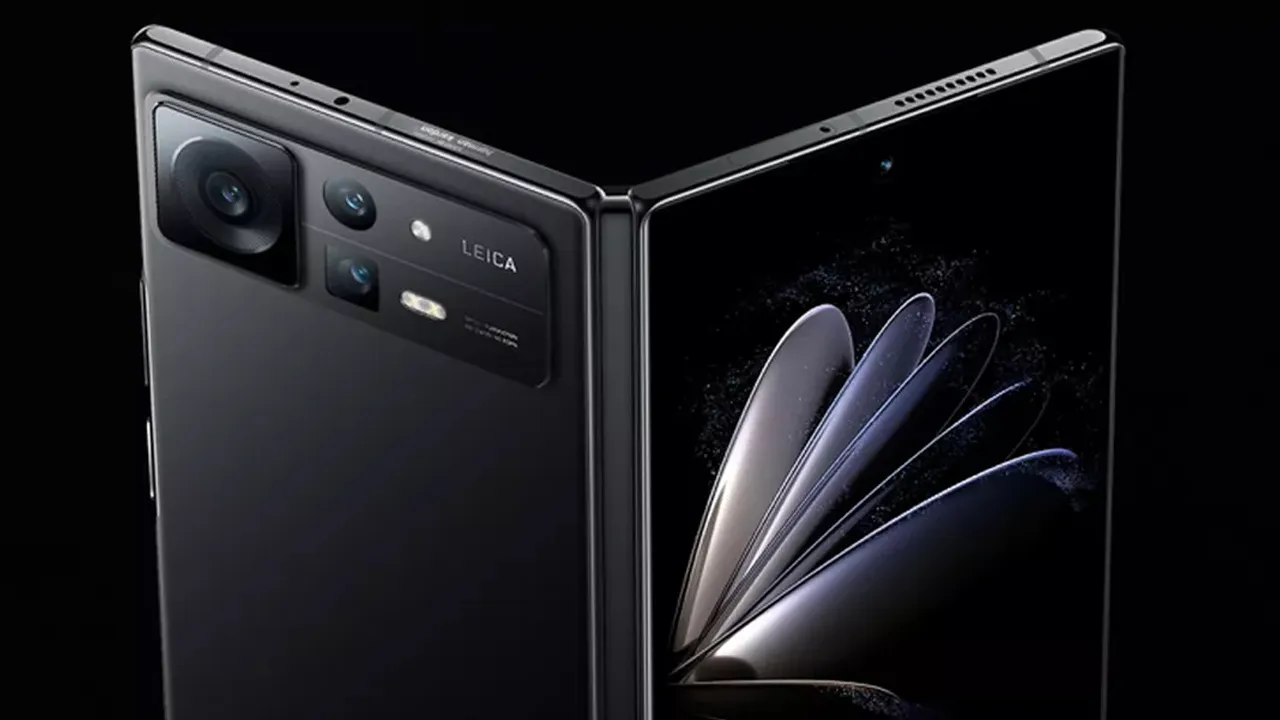 Two black foldable smartphones facing opposite directions, showing a Leica-branded multi-lens rear camera module on the left and a curved edge-to-edge display on the right.