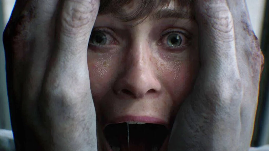 Close up of a Woman with Wide Eyes and Hands on Her Face Showing Fear or Panic