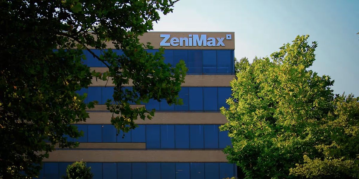 Zenimax Office Building Partially Obscured by Green Trees in Foreground