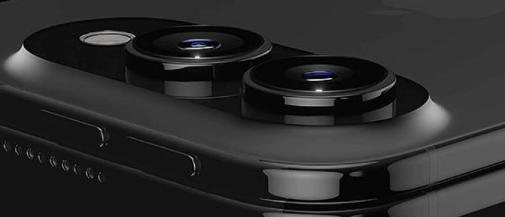 1000048304 Close-up of a black smartphone back with dual camera lenses on top edge area of the device.