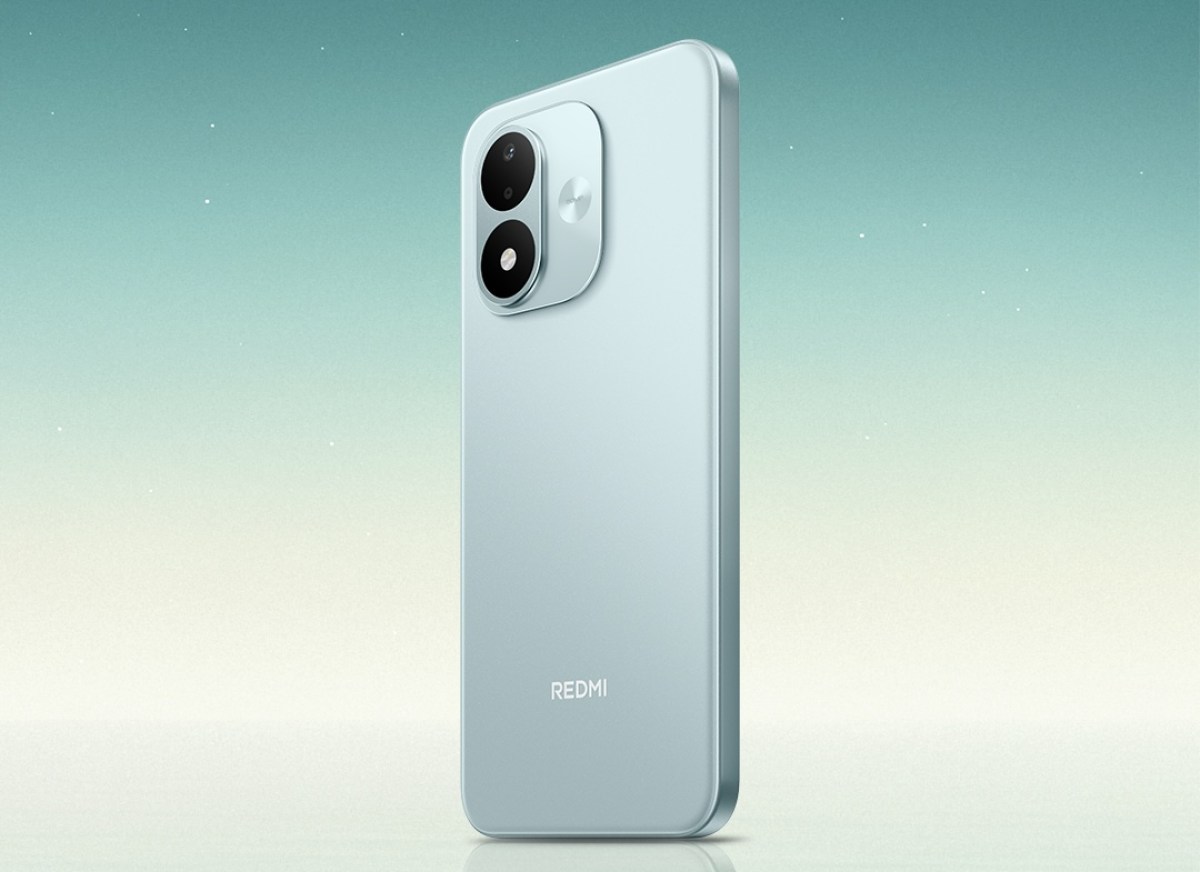 gsmarena_001 Back view of a light blue Redmi smartphone with a dual-camera module against a pale gradient background.