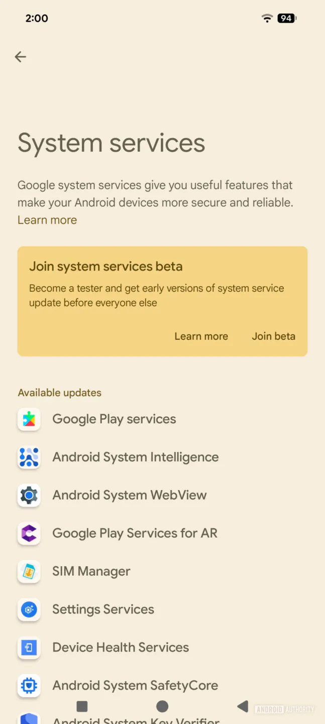 System services screen with a beige background, introductory text, and a yellow card inviting users to join the beta program, plus a list of available updates like Google Play services and Android System Intelligence