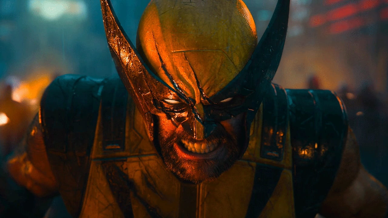 Close up of a Costumed Fighter in Yellow Armor and a Jagged Helmet Snarling with Teeth Bared Amid Warm Lighting
